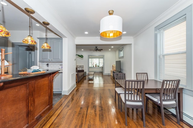 dining space with ceiling fan, recessed lighting, dark wood-style flooring, and ornamental molding