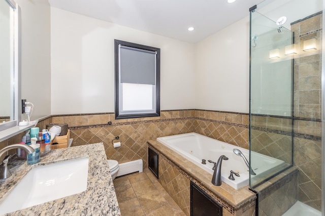 full bath featuring a jetted tub, toilet, tiled shower, tile patterned floors, and a baseboard radiator