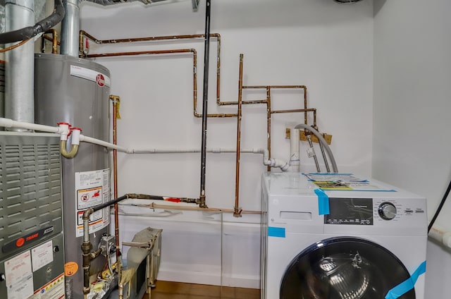 116 Ogden Ave Unit Ga, Jersey City, NJ 07307 - washroom featuring washer / clothes dryer and water heater