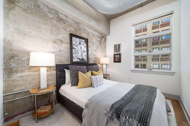 140 Bay St Unit 6E, Jersey City, NJ 07302 - bedroom featuring wood finished floors and baseboards