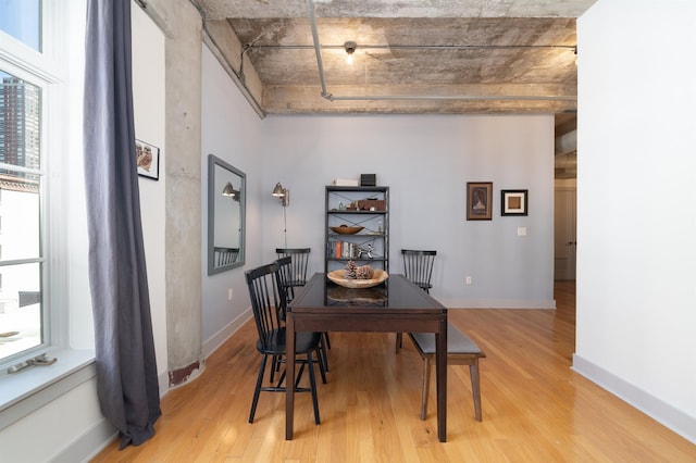 140 Bay St Unit 6E, Jersey City, NJ 07302 - dining area featuring light wood finished floors and baseboards