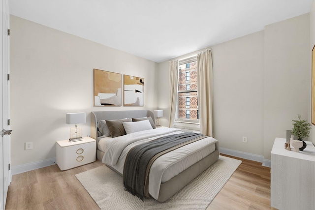 bedroom with light hardwood / wood-style floors