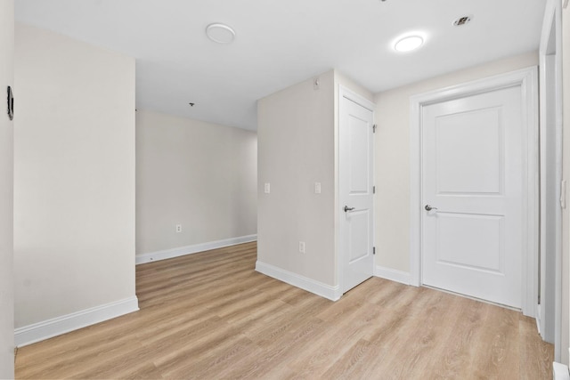 empty room with light wood-type flooring