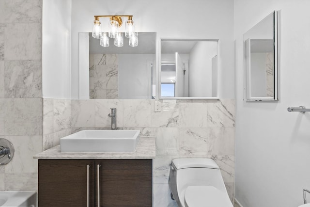 bathroom featuring tile walls, vanity, and toilet