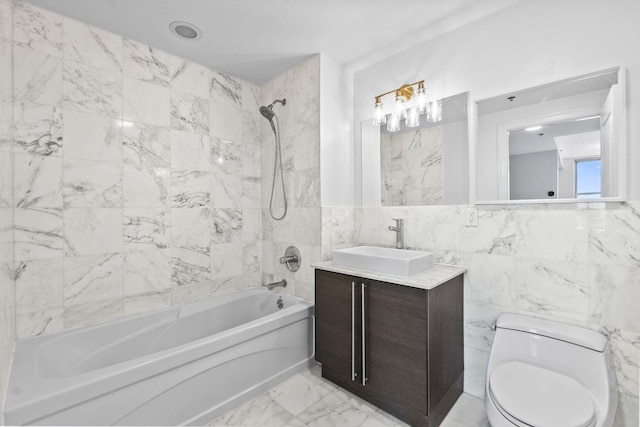 full bathroom featuring toilet, shower / washtub combination, tile walls, and vanity