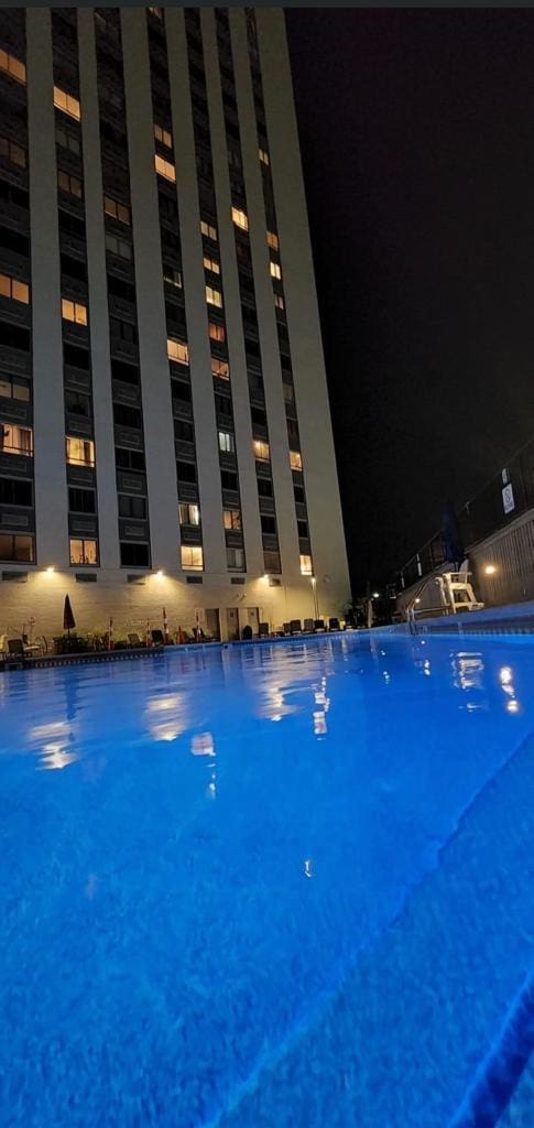 100 Manhattan Ave Unit 1301, Union City, NJ 07087 - pool at night featuring a community pool