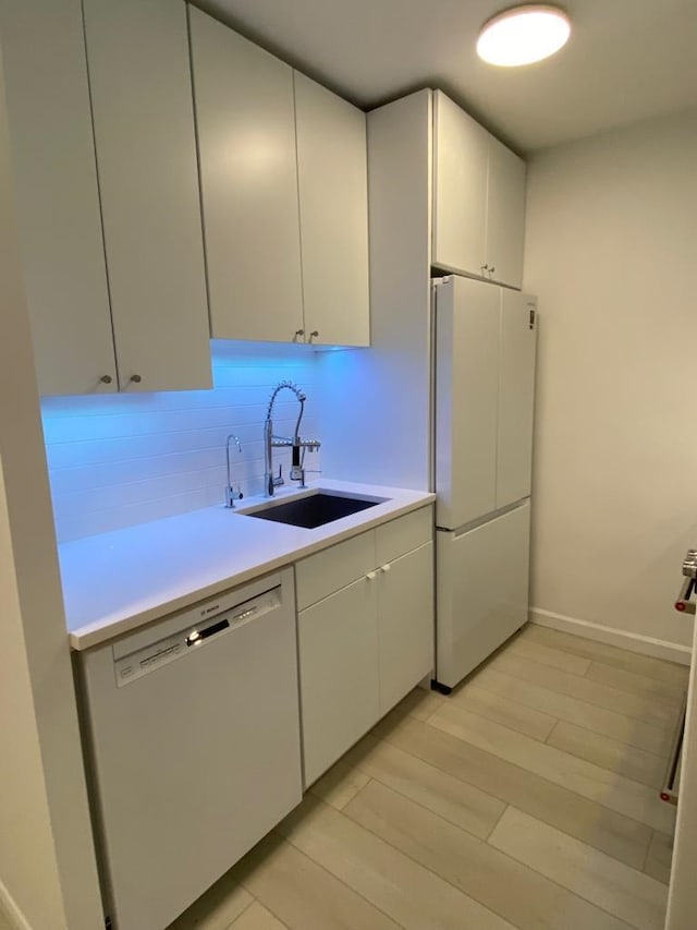 100 Manhattan Ave Unit 1301, Union City, NJ 07087 - kitchen with freestanding refrigerator, dishwasher, light countertops, backsplash, and white cabinetry