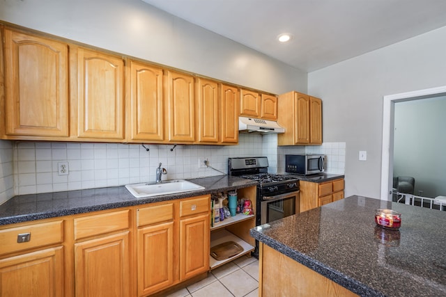 kitchen with tasteful backsplash, sink, light tile patterned floors, and stainless steel appliances