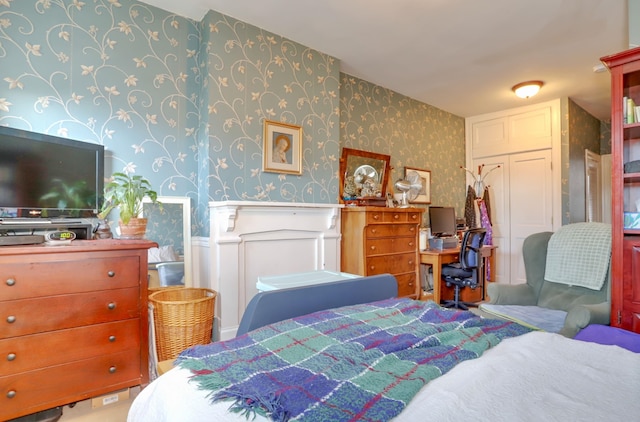 329 Adams St Unit 4, Hoboken, NJ 07030 - bedroom with wallpapered walls, a wainscoted wall, and carpet floors