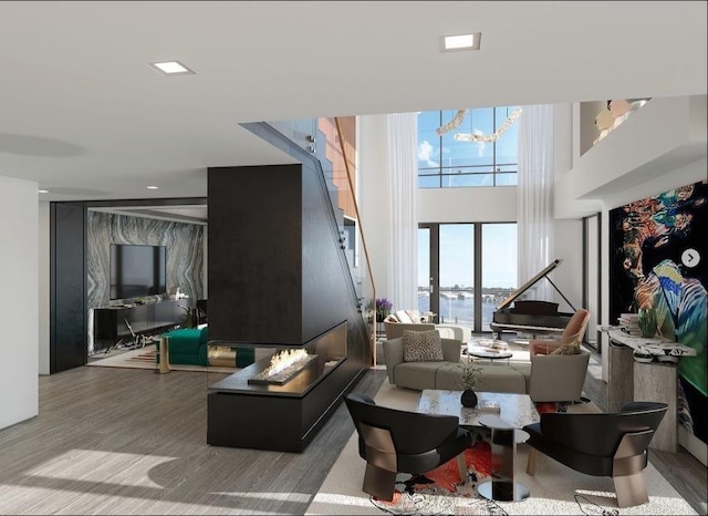 320 Adolphus Ave Unit 1415, Cliffside Park, NJ 07010 - living area featuring a towering ceiling, a chandelier, wood finished floors, stairway, and a water view