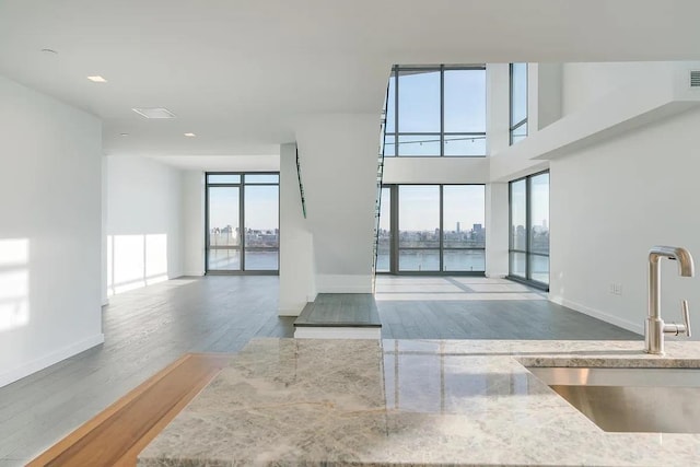 320 Adolphus Ave Unit 1415, Cliffside Park, NJ 07010 - interior space featuring a sink, plenty of natural light, a water view, and wood finished floors