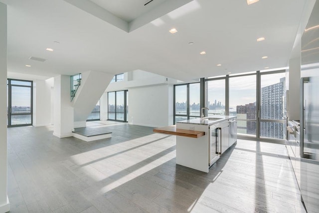 320 Adolphus Ave Unit 1415, Cliffside Park, NJ 07010 - common area featuring expansive windows, a sink, stairway, a city view, and recessed lighting