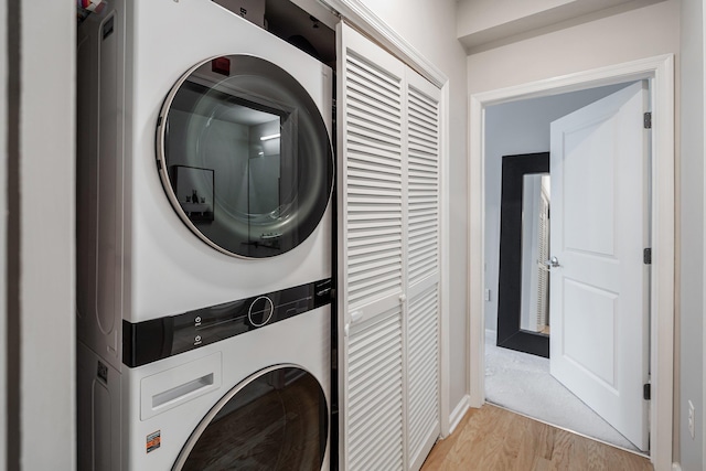 30 Freedom Way Unit 302, Jersey City, NJ 07305 - washroom with stacked washer / drying machine and light wood-style floors