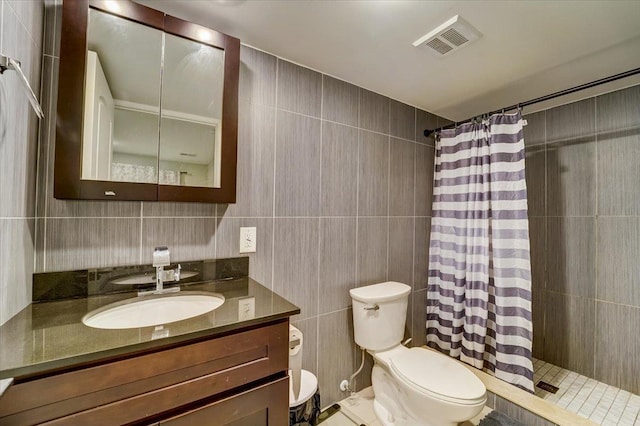 2765 Kennedy Blvd Unit 1, Jersey City, NJ 07306 - bathroom with tile walls, vanity, and tiled shower