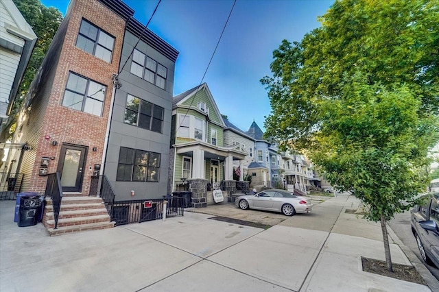 2765 Kennedy Blvd Unit 1, Jersey City, NJ 07306 - view of front facade with brick siding and a residential view