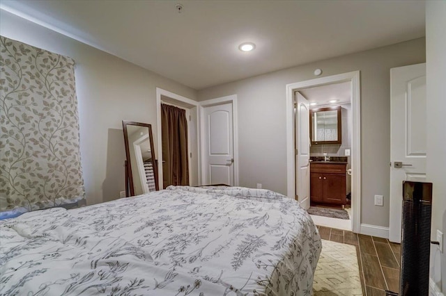 2765 Kennedy Blvd Unit 1, Jersey City, NJ 07306 - bedroom featuring wood finish floors, recessed lighting, and ensuite bathroom