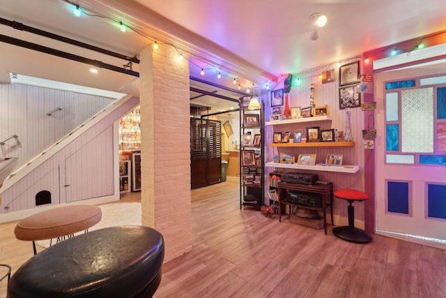 interior space with hardwood / wood-style flooring and decorative columns