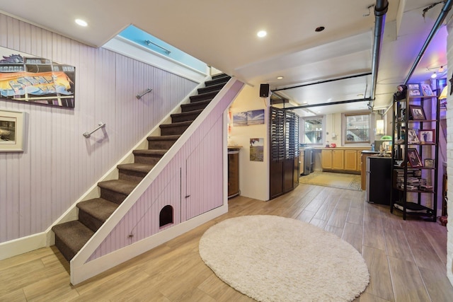 staircase featuring wood-type flooring