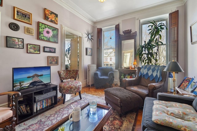 living area with crown molding, parquet flooring, and radiator