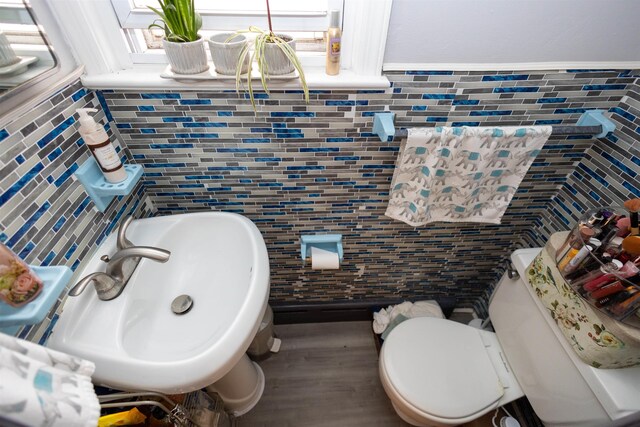 9005 Durham Ave, North Bergen, NJ 07047 - bathroom with tile walls, wood finished floors, and tasteful backsplash