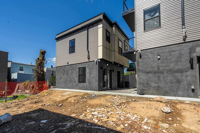 103 Poplar St Rear House, Rear House, Jersey City, NJ 07307 - rear view of house featuring stucco siding
