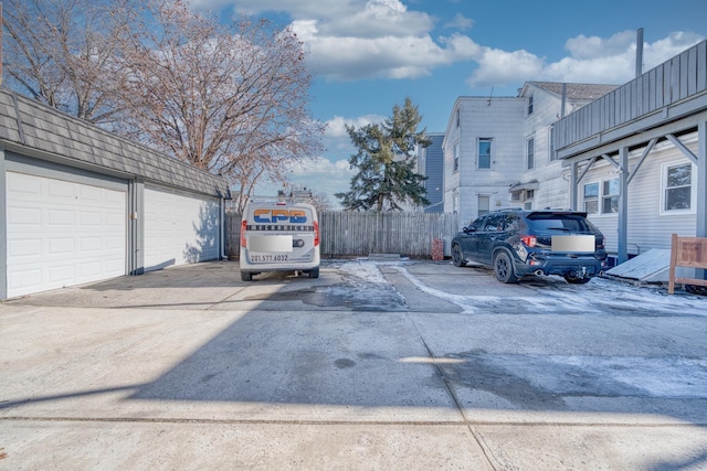 view of car parking with a garage