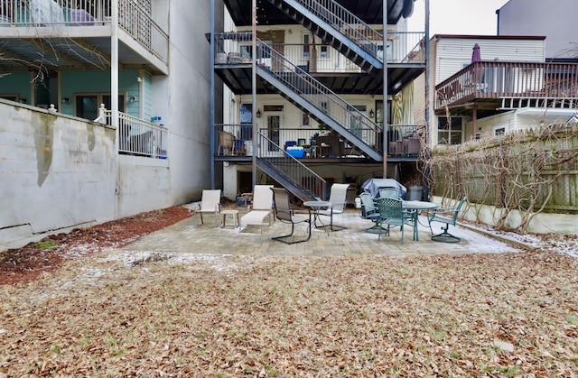 back of house with a patio