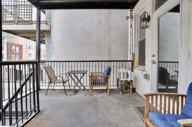 balcony featuring a wall mounted air conditioner