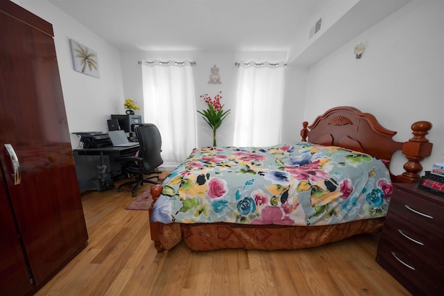 bedroom with light hardwood / wood-style floors