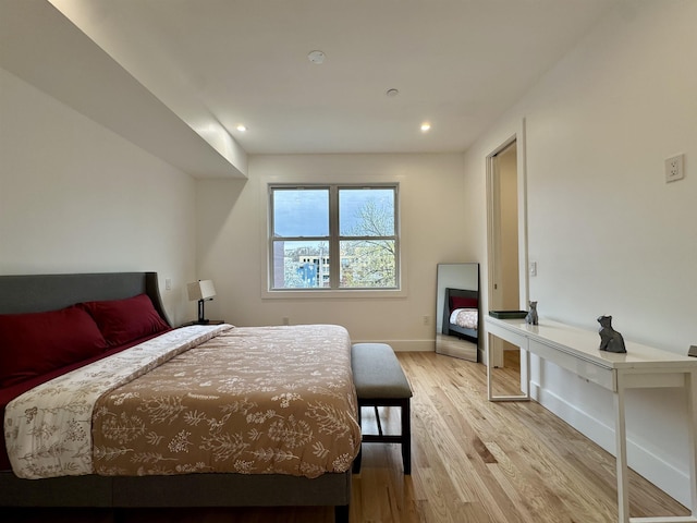 bedroom featuring recessed lighting, light wood-style flooring, and baseboards