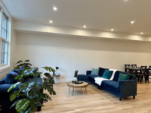 living area with recessed lighting and light wood-type flooring