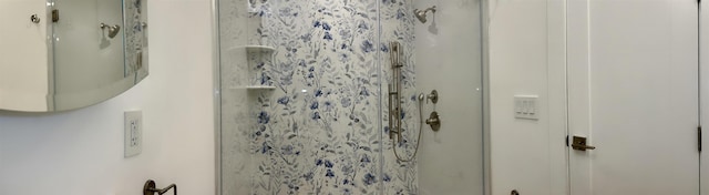 bathroom featuring a shower stall