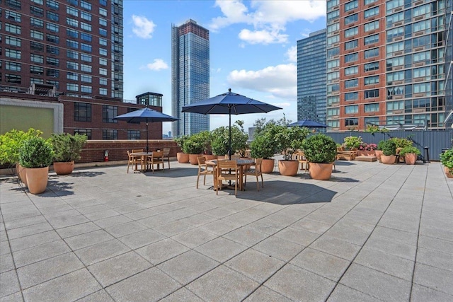 389 Washington St Unit 34E, Jersey City, NJ 07302 - view of patio / terrace featuring a city view and outdoor dining space