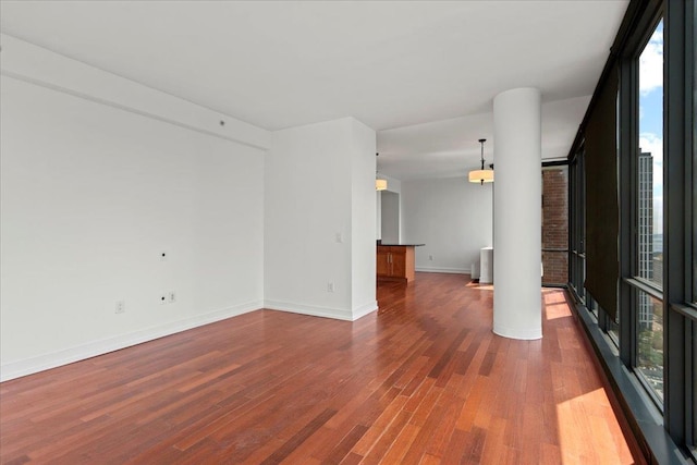 389 Washington St Unit 34E, Jersey City, NJ 07302 - unfurnished room featuring dark wood finished floors and baseboards