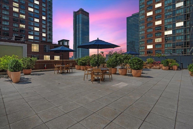 389 Washington St Unit 34E, Jersey City, NJ 07302 - patio terrace at dusk with a patio area