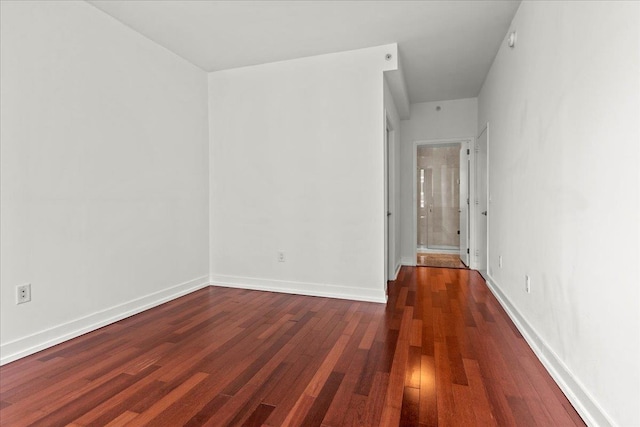 389 Washington St Unit 34E, Jersey City, NJ 07302 - spare room with wood finished floors and baseboards