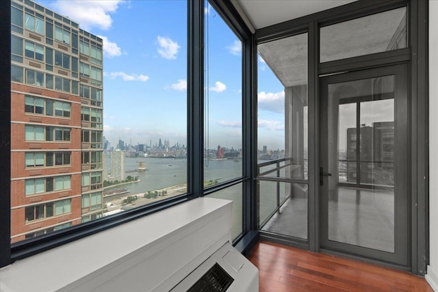 389 Washington St Unit 34E, Jersey City, NJ 07302 - unfurnished sunroom featuring a view of city and a water view