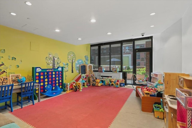389 Washington St Unit 34E, Jersey City, NJ 07302 - recreation room with recessed lighting and expansive windows