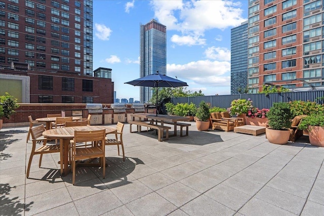 389 Washington St Unit 34E, Jersey City, NJ 07302 - view of patio / terrace with an outdoor kitchen and a view of city