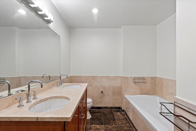 389 Washington St Unit 34E, Jersey City, NJ 07302 - full bath with a garden tub, double vanity, a wainscoted wall, tile walls, and recessed lighting