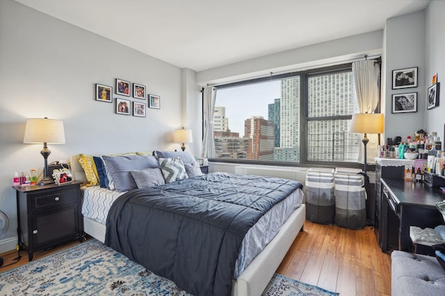 bedroom with light hardwood / wood-style floors