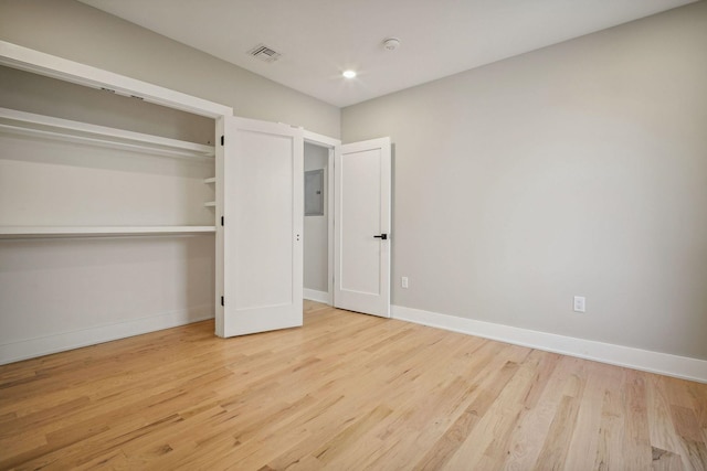 211 Summit Ave Unit 1, Jersey City, NJ 07304 - unfurnished bedroom featuring electric panel, light wood-style flooring, visible vents, recessed lighting, and baseboards