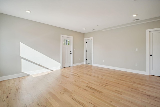 211 Summit Ave Unit 1, Jersey City, NJ 07304 - unfurnished room featuring baseboards, visible vents, light wood finished floors, and recessed lighting
