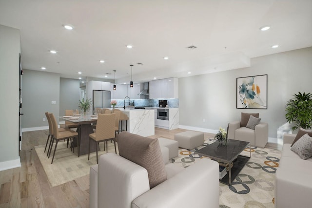211 Summit Ave Unit 1, Jersey City, NJ 07304 - living area with recessed lighting, light wood-style flooring, visible vents, and baseboards