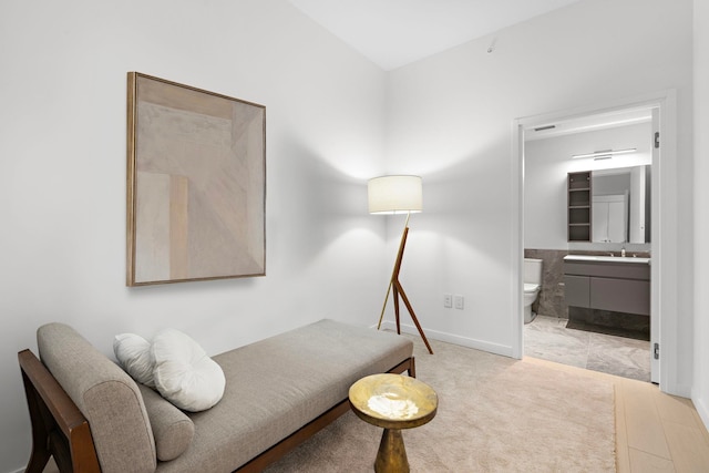 sitting room featuring visible vents and baseboards