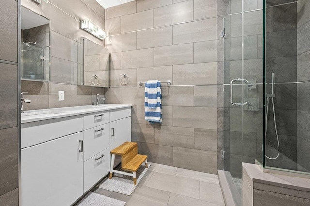 bathroom with vanity, tile patterned flooring, and a shower with shower door