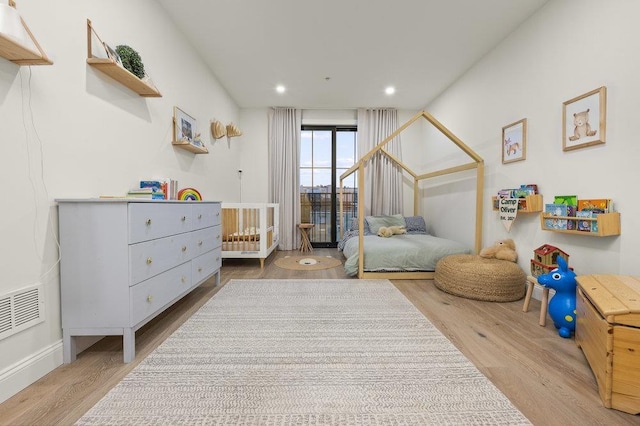 bedroom featuring wood-type flooring