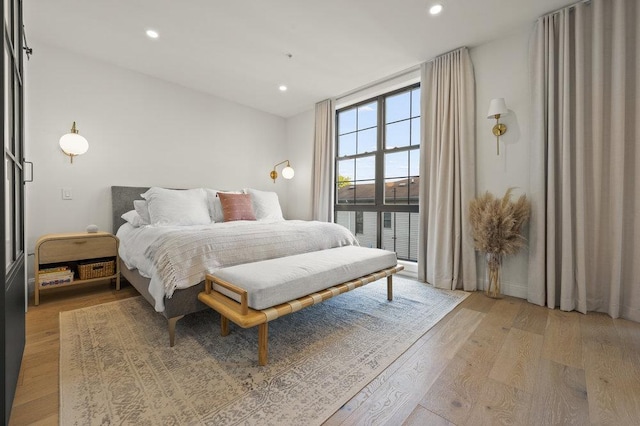 bedroom with hardwood / wood-style flooring