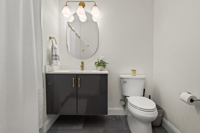 bathroom featuring vanity, tile patterned floors, toilet, and walk in shower