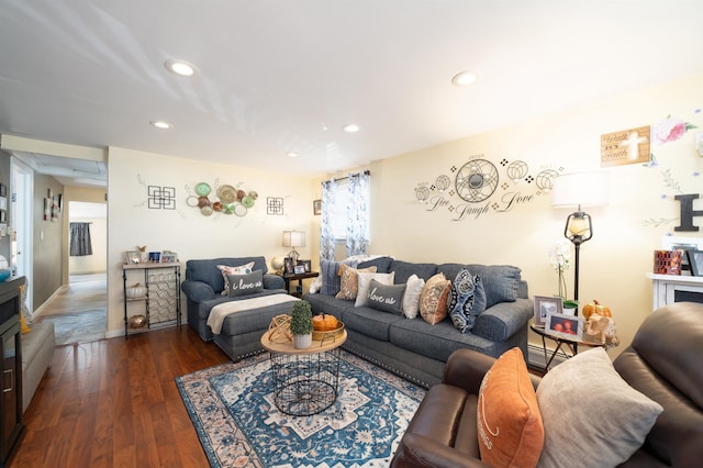 living room featuring recessed lighting, a baseboard radiator, and wood finished floors